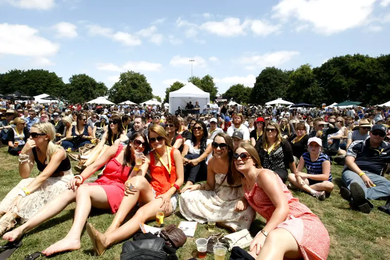 Crowd of young people sitting on the grass, enjoyed the entertainment at Ballarat Beer Festival