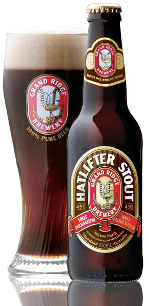 A bottle and full glass of Grand Ridge Hat lifter stout