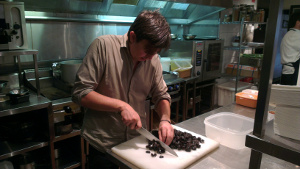 Andrew McConnell preparing prunes In 4 Pines' kitchen
