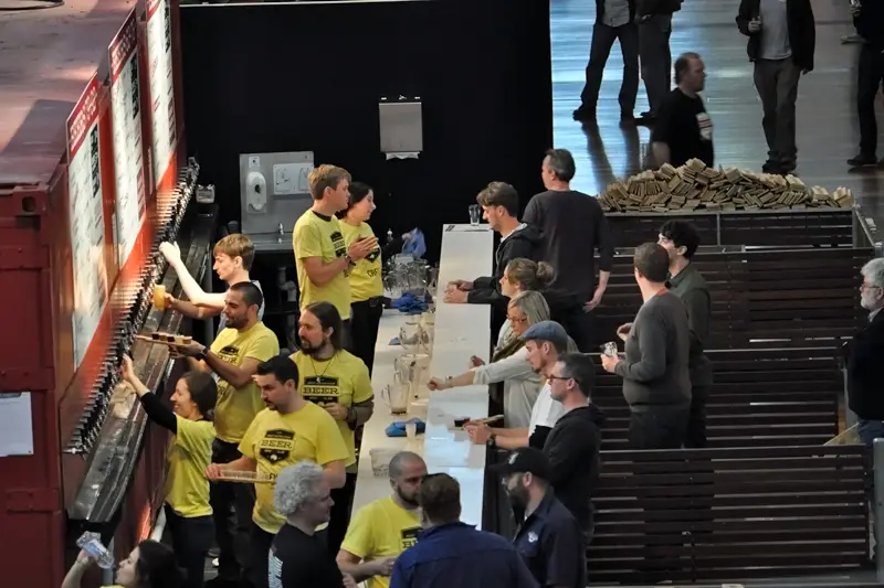 A view of a GABS bar with drinkers receiving their festival beers