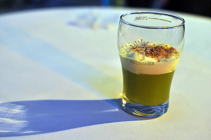 A tasting glass of the green Just Desserts beer