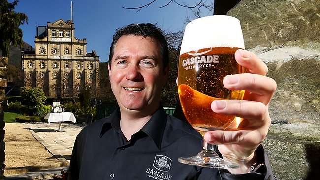 Head Brewer, Mike Unsworth raises a glass to Cascade's new look. (Pic Courier Mail)