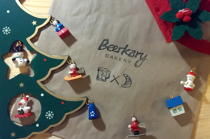Beerkary Bakery logo surrounded by Christmas decorations