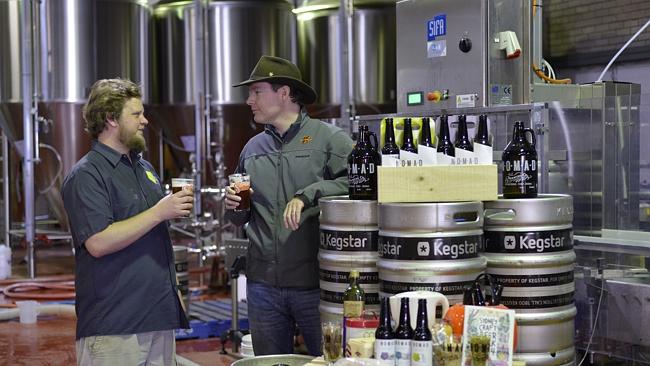Shane Welch (right) shares a beer with Nomad Brewing's Brooks Caretta in the new Brookvale brewery