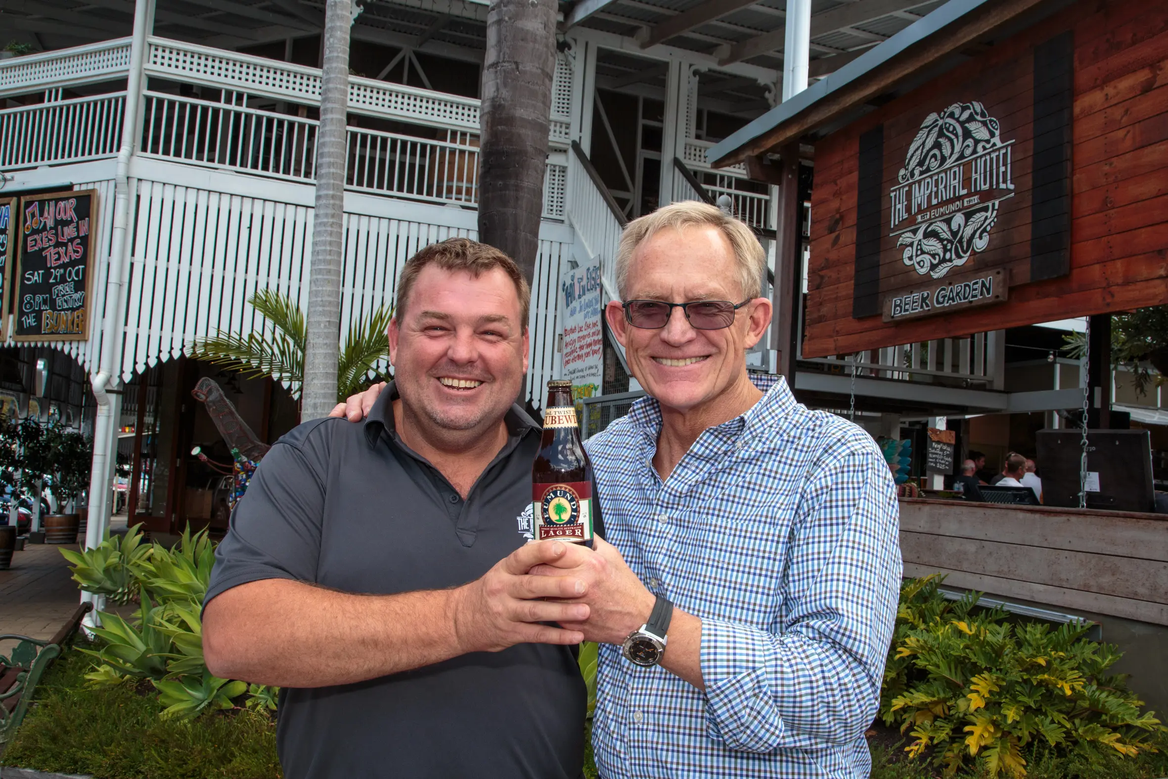 Fenlon and Hahn with a bottle of the old Eumundi Lager