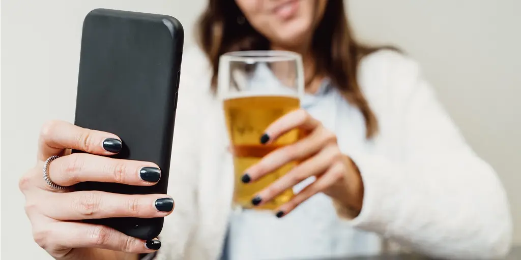 Online,Clinking.,Girl,Sitting,At,A,Table,Talking,In,Video