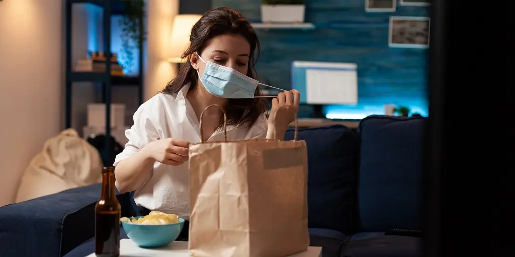 Cheerful,Woman,Taking,Medical,Protection,Face,Mask,Out,After,Purchasing