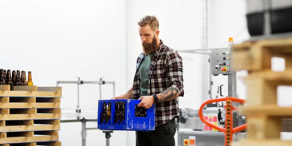 Production,,Small,Business,And,People,Concept,-,Man,With,Bottles