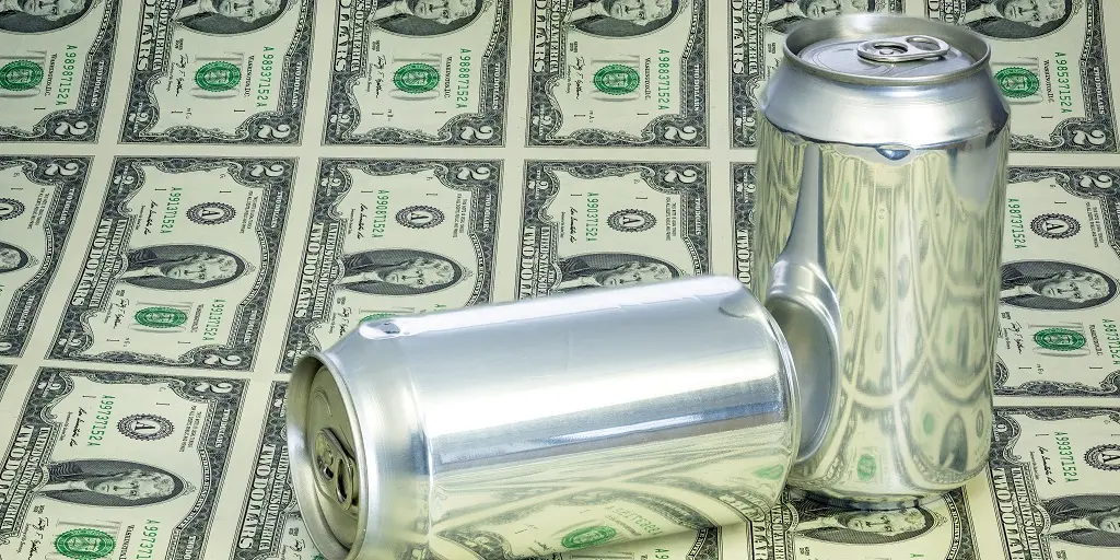 Two,Unmarked,Cans,Of,Soda,And,$2,Bills