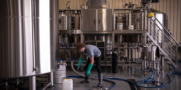 Man working with Mountain Culture's 25l brewhouse
