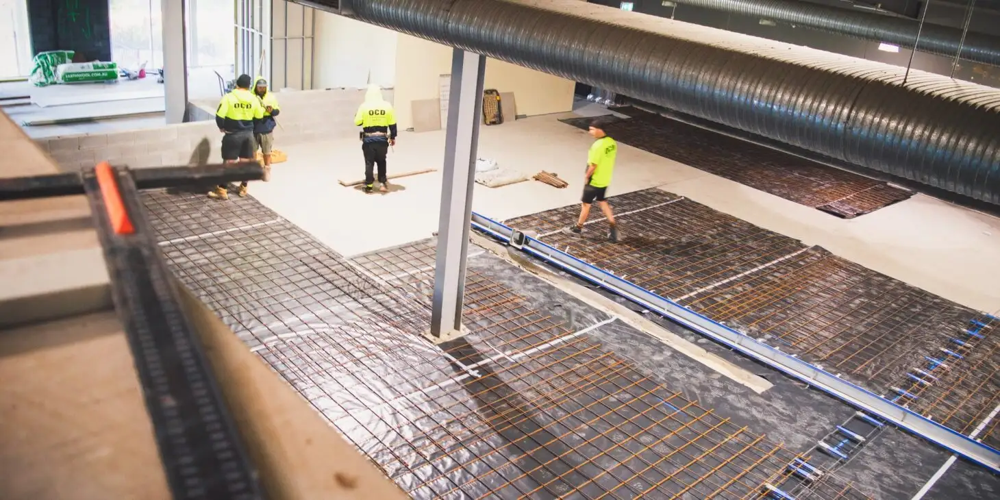 High angle shot of workers at the construction site of 10 Toes Brewery