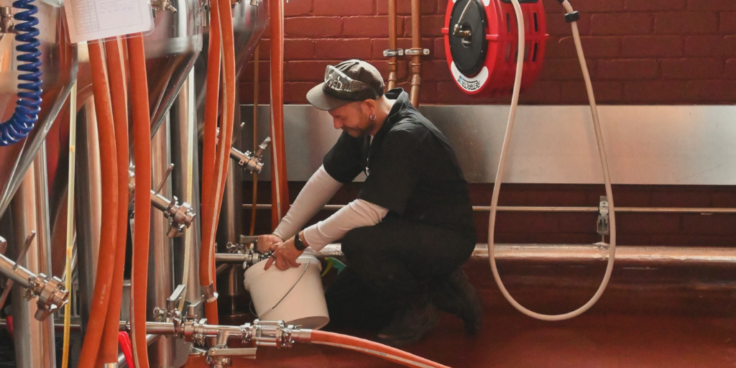 Head Brewer Tristan Barlow with brewing equipment at Yellow Matter Brewing
