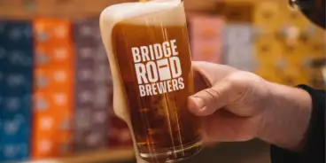Bridge Road Brewers glass being filled with beer