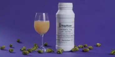 Bottle of Hop Haze next to a wine glass