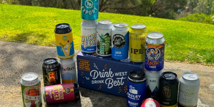 Cans of beer surrounding a WABA Drink West Drink mixed pack