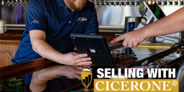 Man sitting at a table with an iPad. Words "Selling with Cicerone" at bottom right