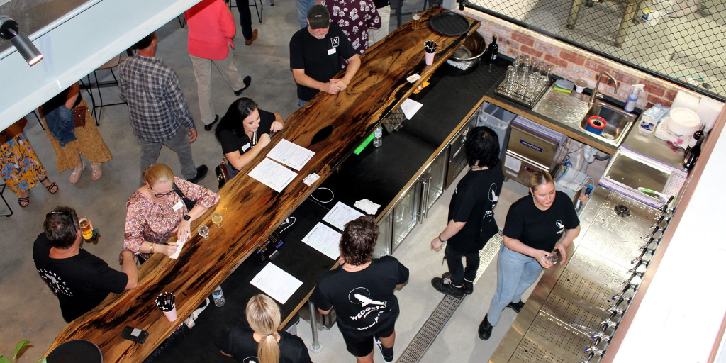 High angle shot of staff behind bar at Wedgetail Brewing