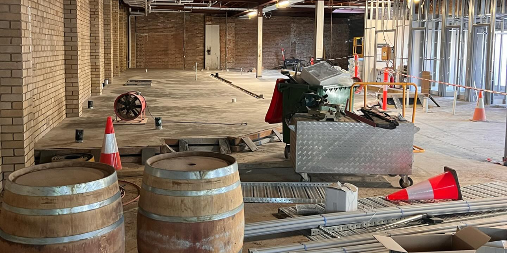 Kegs and construction equipment at Pickled Monkey site