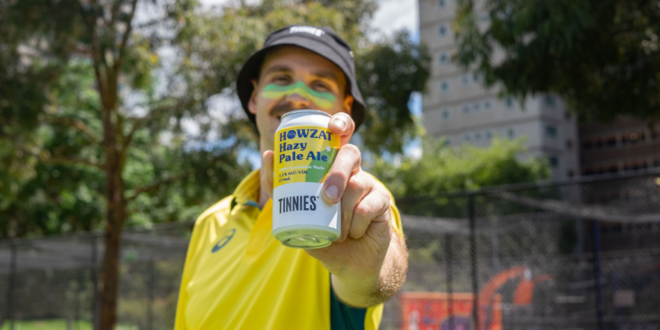 Australian cricketer holding HOWZAT Hazy Pale Ale