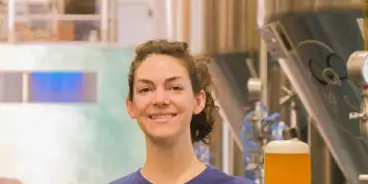 Head Brewer Simone Clements holding Gage Roads' new beer, the Twin Fin