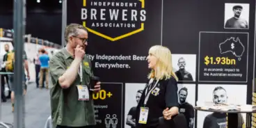 IBA stall with two people talking