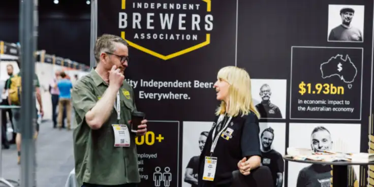 IBA stall with two people talking